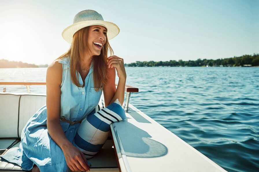 WOMAN ON BOAT ON LAKE