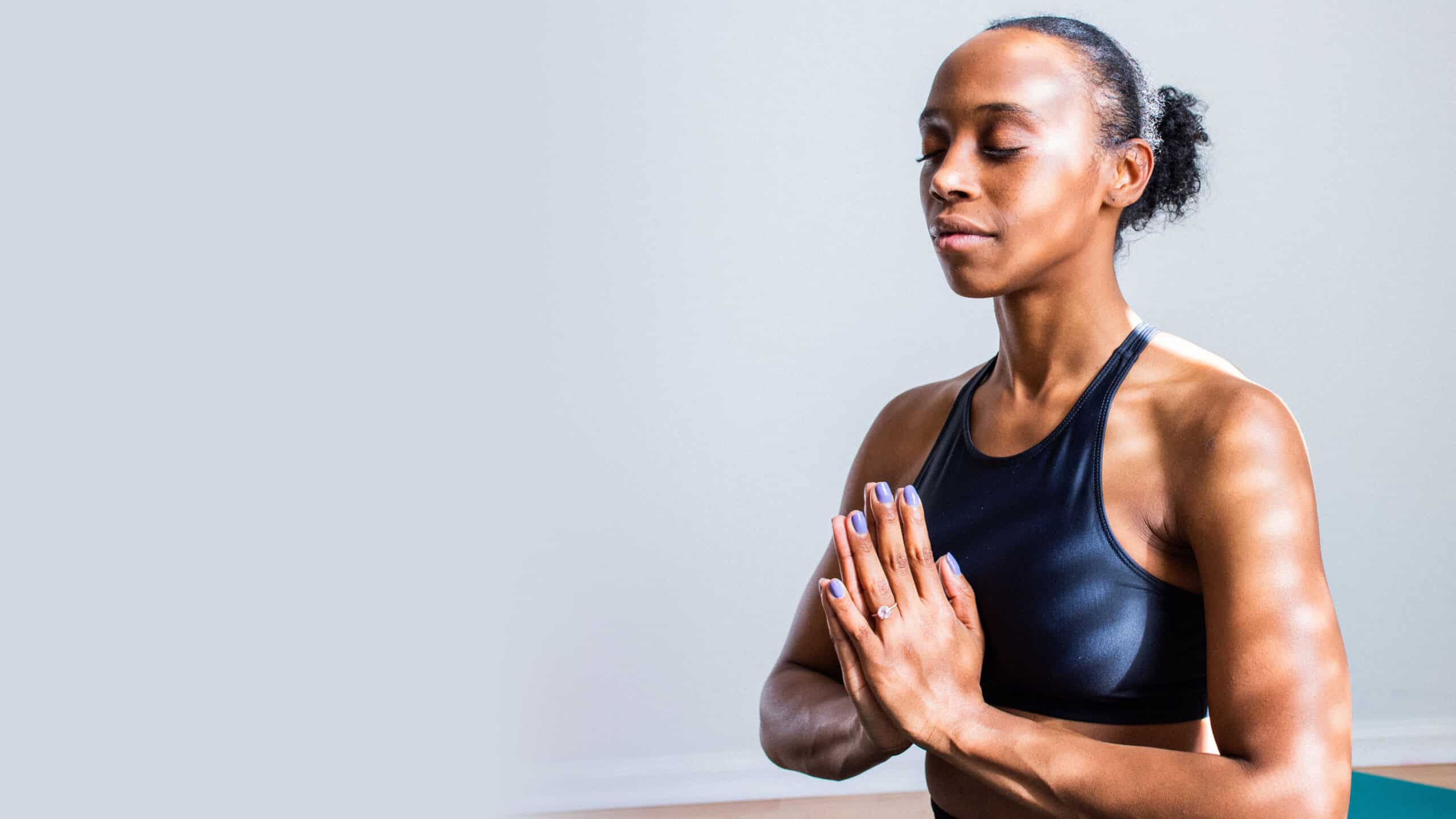 WOMAN DOING YOGA