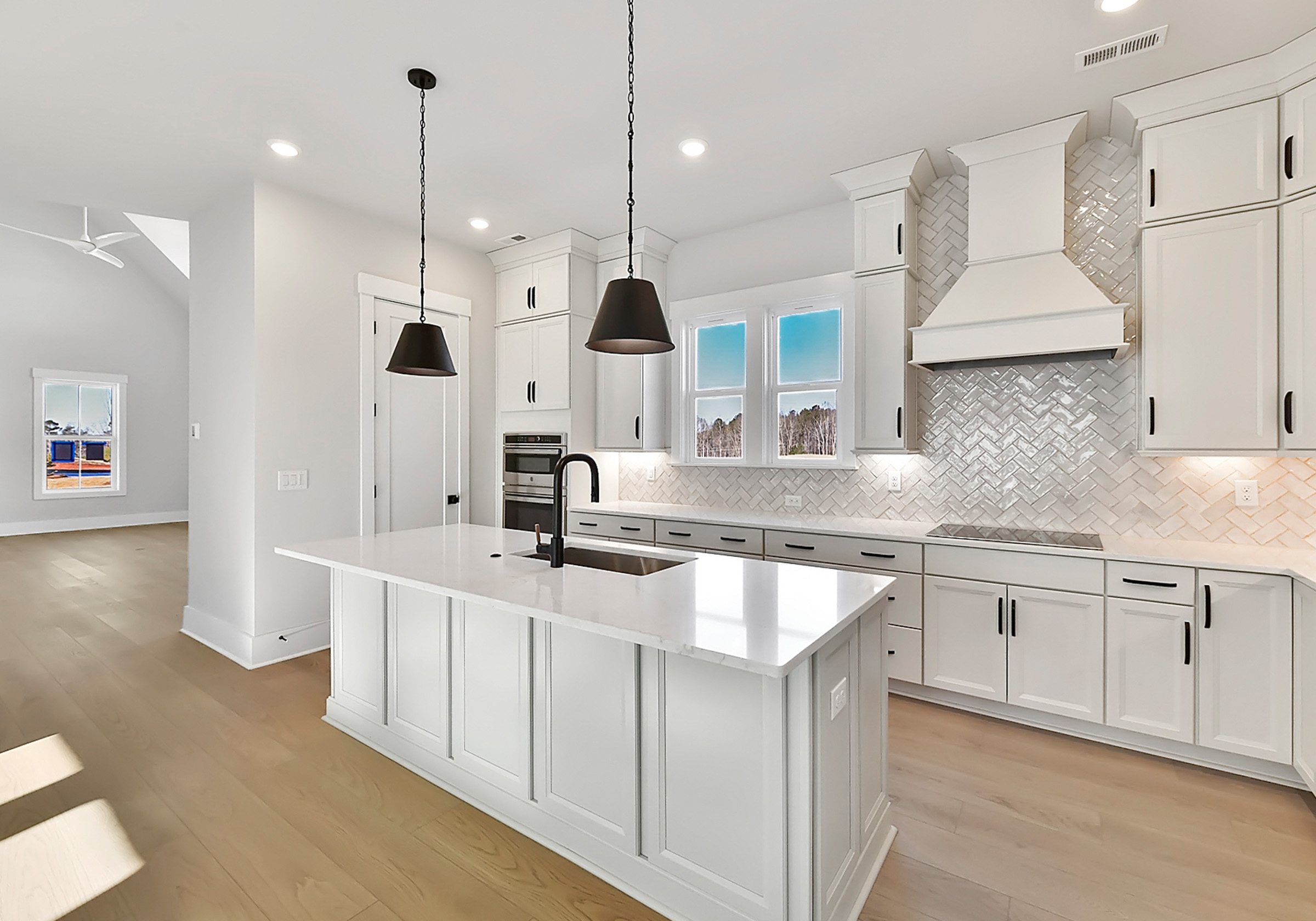  - View 3, Opens Model BoxAn interior shot of the kitchen of 4314 Morning Mist Drive, focused on the island.