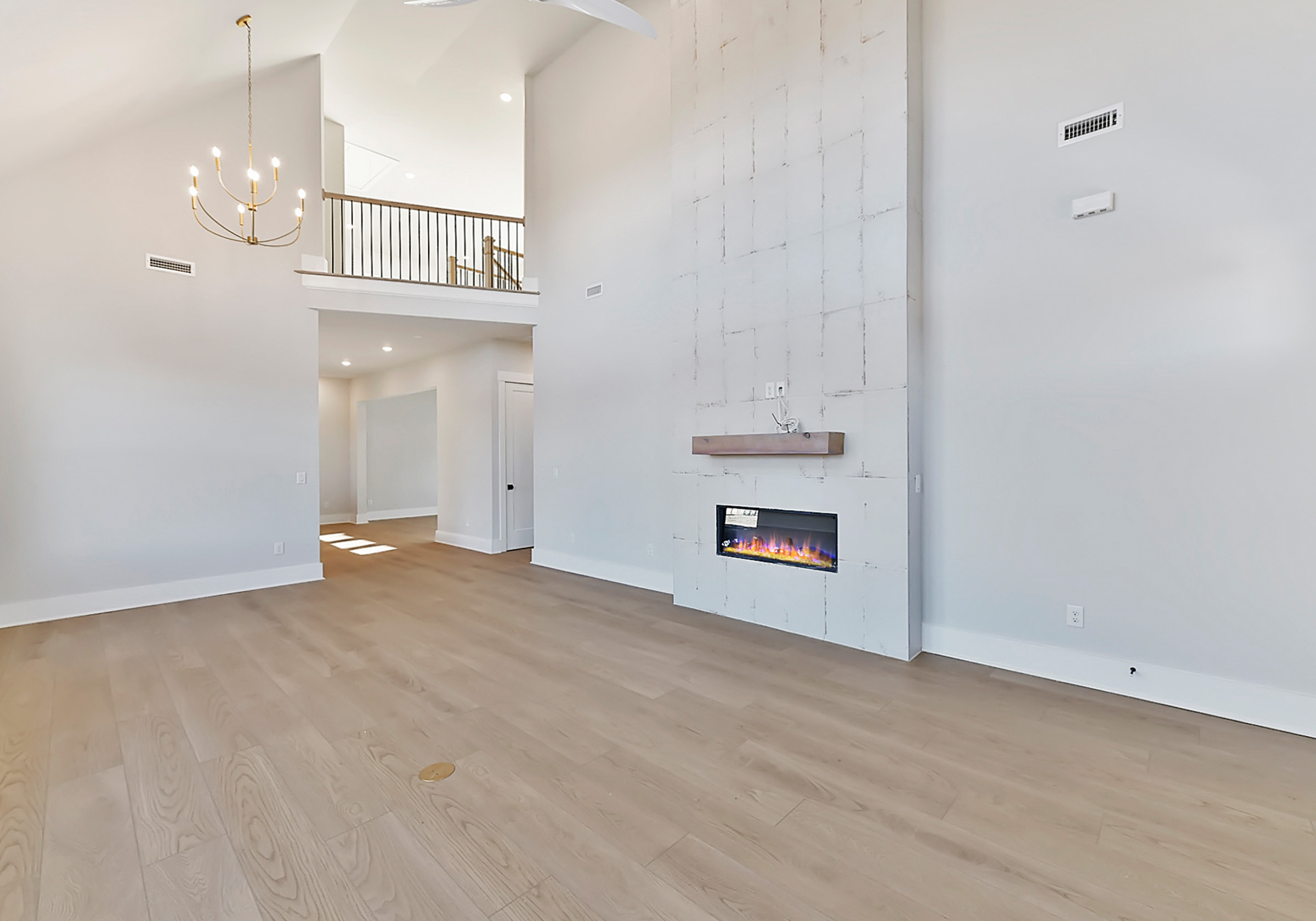  - View 6, Opens Model BoxAn interior shot of the living room of 4314 Morning Mist Drive focused on the fireplace.
