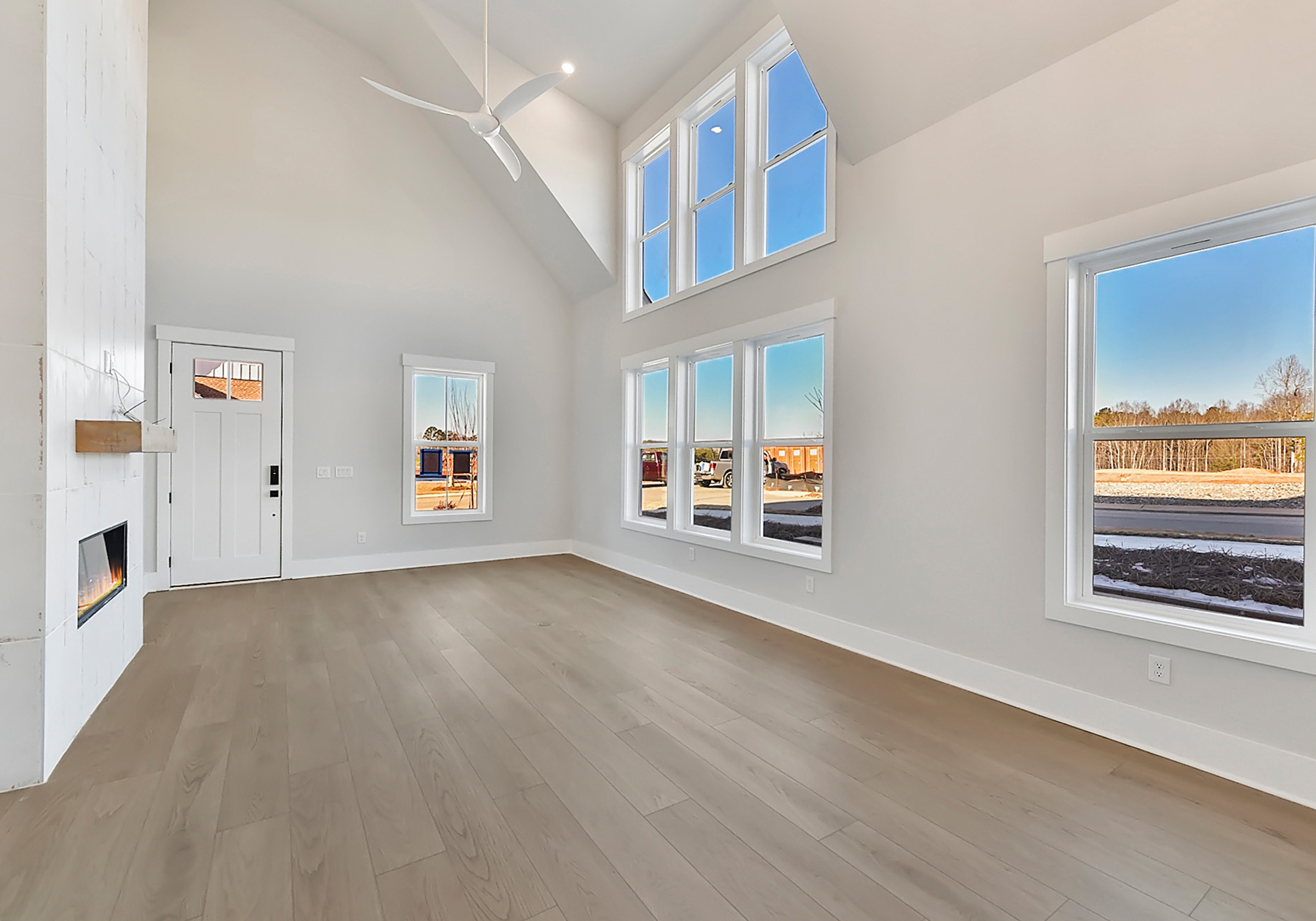  - View 5, Opens Model BoxAn interior shot of the living room of 4314 Morning Mist Drive focused on the windows.