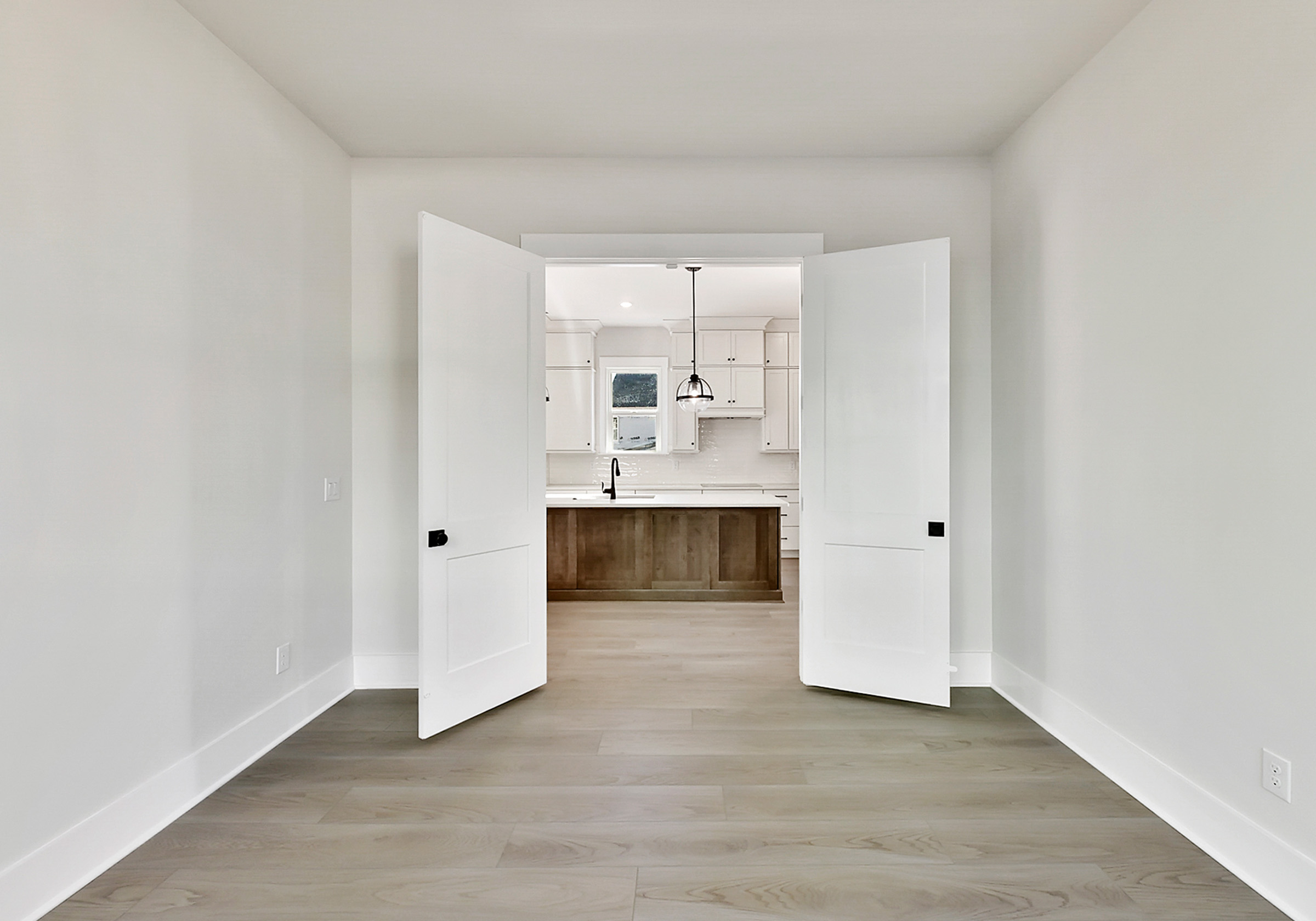 - View 2, Opens Model BoxAn interior shot of the dining room of 4379 Morning Mist Drive, focused on how it leads into the kitchen.