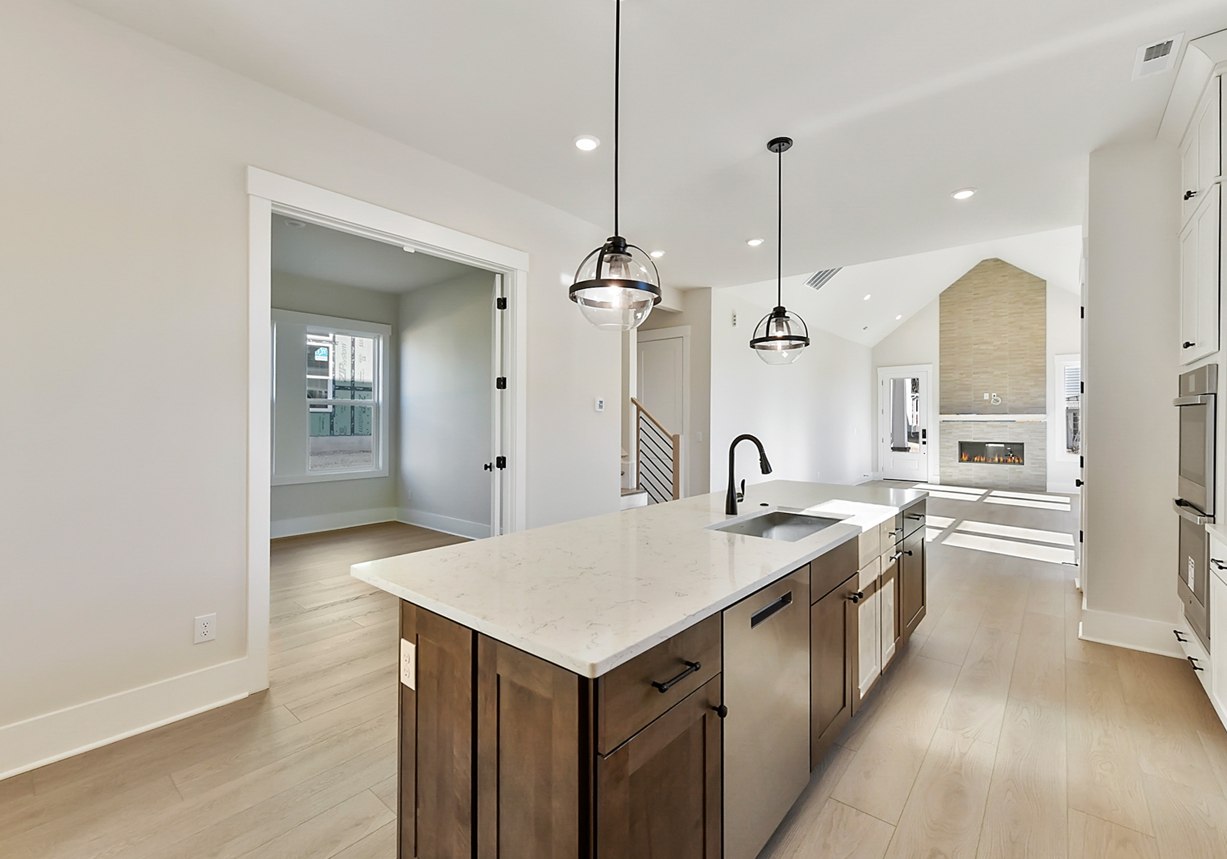 - View 4, Opens Model BoxAn interior shot of the kitchen of 4379 Morning Mist Drive, focused on the kitchen and how it leads into the living room.