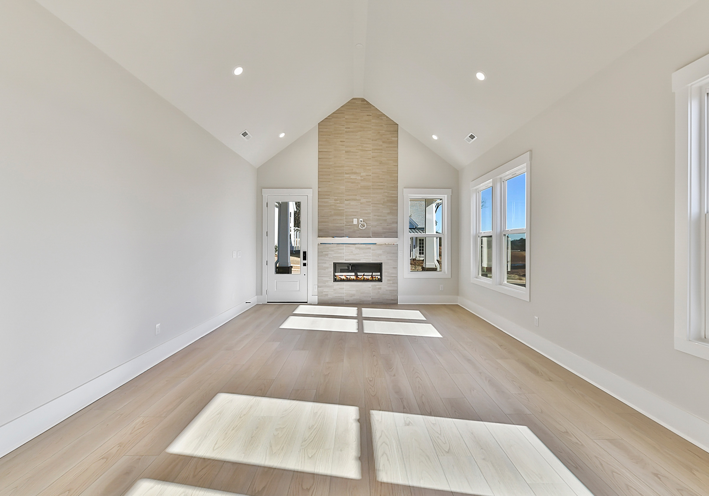 - View 6, Opens Model BoxAn interior shot of the kitchen of 4379 Morning Mist Drive, focused on the size of the room, including the fireplace.