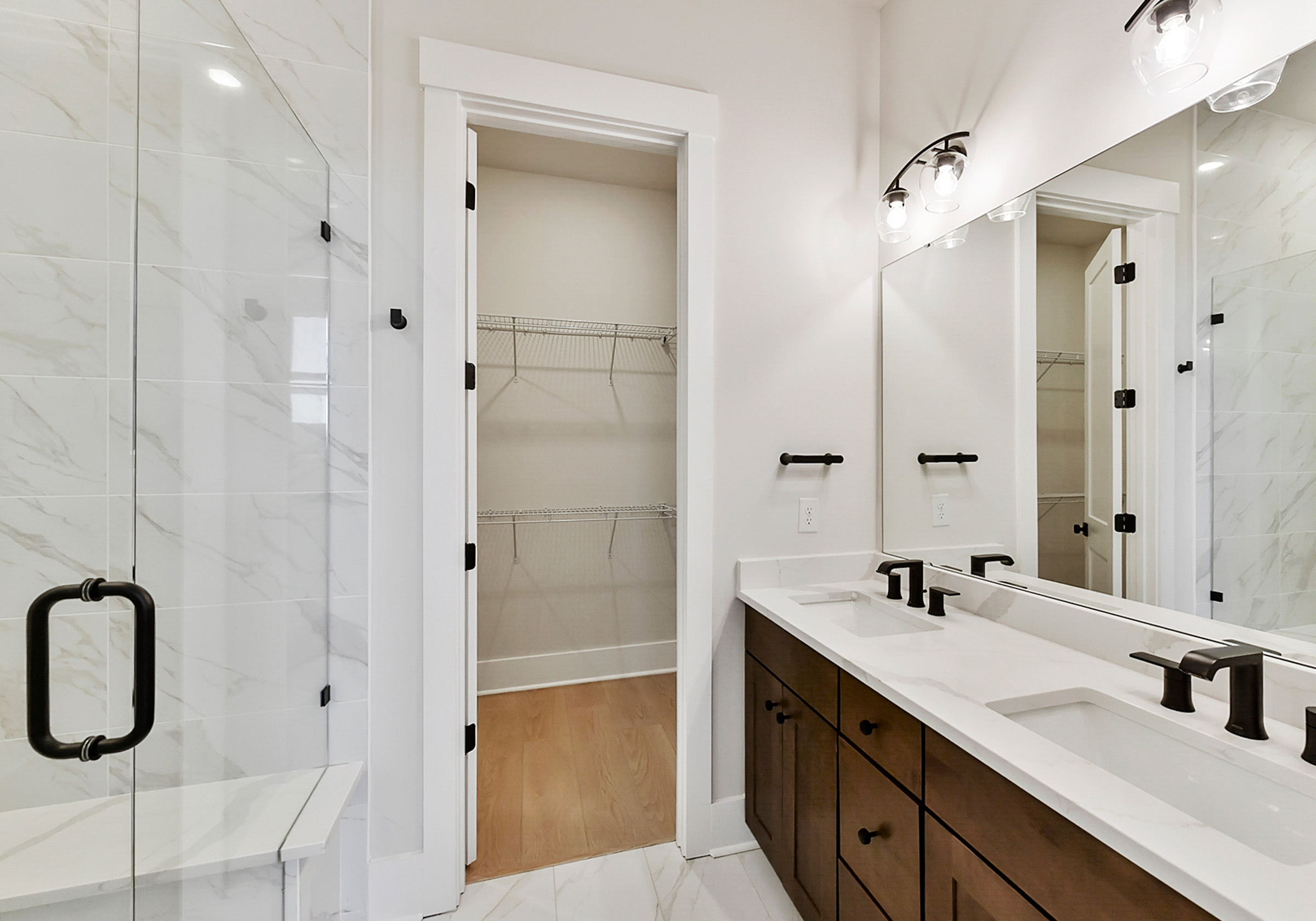 - View 8, Opens Model BoxAn interior shot of the primary bathroom of 4379 Morning Mist Drive, focused on the closet.